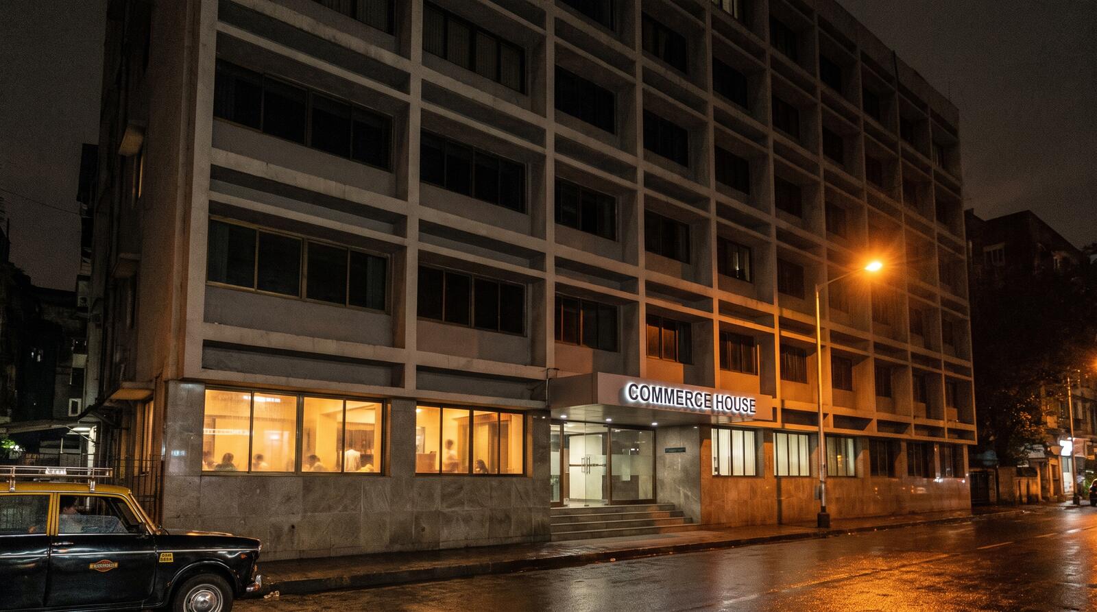 The facade of Terminus House at night