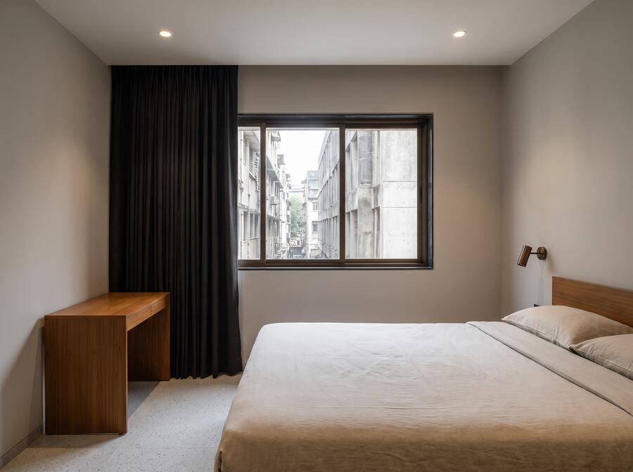 Double room facing the street, blackout curtain drawn back