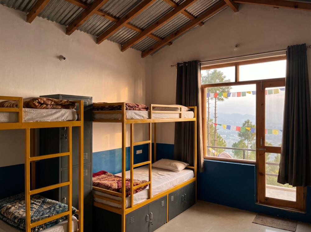 The female-only dorm on the top floor, three bunks and a window onto the valley